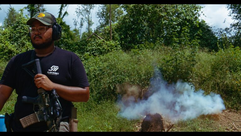 cinematic image of a man walking away from an expolsion